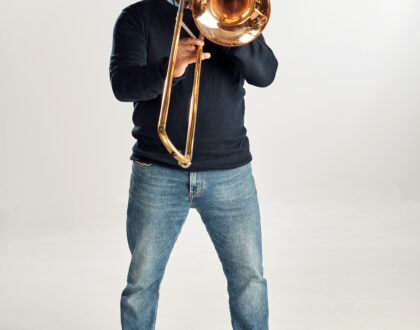 porträtt på musiker med saxofon